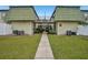 Building exterior with walkway and landscaping at 1799 N Highland Ave # 136, Clearwater, FL 33755