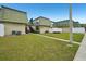 Building exterior with green lawn and pathway at 1799 N Highland Ave # 136, Clearwater, FL 33755