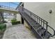 Exterior metal staircase leading to second floor at 1799 N Highland Ave # 136, Clearwater, FL 33755