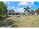 Large backyard with fire pit and screened porch at 18292 Robinson Ave, Port Charlotte, FL 33948