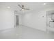 Well-lit bedroom with a ceiling fan and access to the kitchen at 18292 Robinson Ave, Port Charlotte, FL 33948