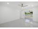 Bedroom with sliding glass doors to backyard and ceiling fan at 18292 Robinson Ave, Port Charlotte, FL 33948