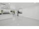 Modern kitchen with white cabinets, black countertops, and stainless steel appliances at 18292 Robinson Ave, Port Charlotte, FL 33948