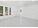 Bright and airy living room with white walls and light gray floors at 18292 Robinson Ave, Port Charlotte, FL 33948