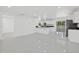 Bright and airy living room with white walls and light gray floors at 18292 Robinson Ave, Port Charlotte, FL 33948