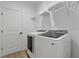 Well-equipped laundry room with washer and dryer at 18400 Tulane Ave, Port Charlotte, FL 33954