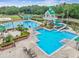Large community pool with lap lanes and a waterslide at 18924 Duquesne Dr, Tampa, FL 33647