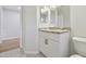 Modern bathroom with white cabinets and granite countertop at 18924 Duquesne Dr, Tampa, FL 33647