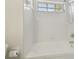 Bright bathroom featuring a white bathtub and shower at 18924 Duquesne Dr, Tampa, FL 33647
