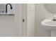 Clean and updated half bathroom with pedestal sink and modern fixtures at 18924 Duquesne Dr, Tampa, FL 33647