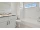 Clean bathroom with white cabinets, granite countertop, and bathtub at 18924 Duquesne Dr, Tampa, FL 33647