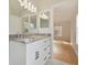 Primary bathroom with granite countertop and view of bedroom at 18924 Duquesne Dr, Tampa, FL 33647