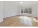 Spacious bedroom with hardwood floors and large windows at 18924 Duquesne Dr, Tampa, FL 33647