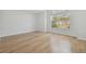 Bright bedroom with hardwood floors and large window at 18924 Duquesne Dr, Tampa, FL 33647