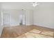 Light-filled bedroom with hardwood floors and access to bathroom at 18924 Duquesne Dr, Tampa, FL 33647