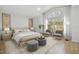 Main bedroom with sitting area and large window at 18924 Duquesne Dr, Tampa, FL 33647