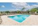 Inviting community pool with plenty of lounge chairs at 18924 Duquesne Dr, Tampa, FL 33647