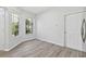 Bright dining area with laminate floors and large windows at 18924 Duquesne Dr, Tampa, FL 33647