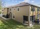 Rear view of townhome showcasing screened porch at 18924 Duquesne Dr, Tampa, FL 33647
