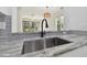 Modern kitchen sink with granite countertop at 18924 Duquesne Dr, Tampa, FL 33647
