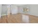 Spacious living room with hardwood floors and large window at 18924 Duquesne Dr, Tampa, FL 33647