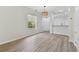 Open concept living area with laminate floors at 18924 Duquesne Dr, Tampa, FL 33647