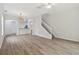 Open living space, laminate floors, kitchen view at 18924 Duquesne Dr, Tampa, FL 33647