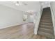 Bright and spacious living room with hardwood floors and view of staircase at 18924 Duquesne Dr, Tampa, FL 33647