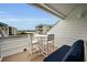 Enjoy morning coffee on this private balcony with seating area and water views at 19915 Gulf Blvd # 605, Indian Shores, FL 33785