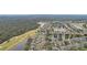 Aerial view of community, showcasing homes and waterways at 2028 Acadia Greens Dr, Sun City Center, FL 33573