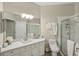 Clean bathroom with a walk-in shower, modern vanity, and updated fixtures at 2028 Acadia Greens Dr, Sun City Center, FL 33573