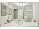Bathroom with a large vanity mirror and updated fixtures at 2028 Acadia Greens Dr, Sun City Center, FL 33573