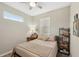Comfortable bedroom with a full-size bed and a window seat at 2028 Acadia Greens Dr, Sun City Center, FL 33573