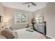 Cozy bedroom with a queen-size bed and built-in shelving at 2028 Acadia Greens Dr, Sun City Center, FL 33573