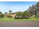 House exterior with manicured lawn and landscaping at 2028 Acadia Greens Dr, Sun City Center, FL 33573
