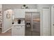 Bright kitchen features white cabinets, stainless steel appliances, and granite countertops at 2028 Acadia Greens Dr, Sun City Center, FL 33573
