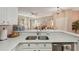 Well-equipped kitchen with stainless steel appliances and white cabinetry at 2028 Acadia Greens Dr, Sun City Center, FL 33573