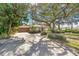 Exterior view of the house with landscaping and driveway at 215 Snell Isle Ne Blvd, St Petersburg, FL 33704