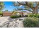 Home's exterior, driveway, and mature trees at 215 Snell Isle Ne Blvd, St Petersburg, FL 33704