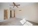 Spacious bedroom with ceiling fan, ensuite bathroom access, and ample closet space at 2320 Shelly Dr # B, Palm Harbor, FL 34684