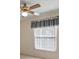 Bright bedroom featuring a window with window treatment and ceiling fan at 2320 Shelly Dr # B, Palm Harbor, FL 34684