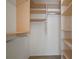 Large walk-in closet with built-in shelving and hanging rods at 2320 Shelly Dr # B, Palm Harbor, FL 34684