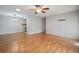 Open dining room with wood floors and kitchen access at 2320 Shelly Dr # B, Palm Harbor, FL 34684