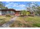 Brick ranch home with carport, mature landscaping, and a spacious yard at 2320 Shelly Dr # B, Palm Harbor, FL 34684