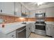 Stainless steel appliances in this galley kitchen at 2320 Shelly Dr # B, Palm Harbor, FL 34684