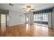 Spacious living room with laminate floors and access to sunroom at 2320 Shelly Dr # B, Palm Harbor, FL 34684