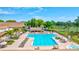 Community pool with plenty of lounge chairs and hot tub at 2320 Shelly Dr # B, Palm Harbor, FL 34684