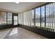 Sunroom with tiled floor and vertical blinds at 2320 Shelly Dr # B, Palm Harbor, FL 34684