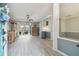 Bright and airy living room with wood-look floors at 2765 Mcnair Dr, Palm Harbor, FL 34683