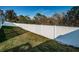 Fully fenced backyard with lush green grass, perfect for privacy and relaxation at 2930 Swan Cir, Dunedin, FL 34698